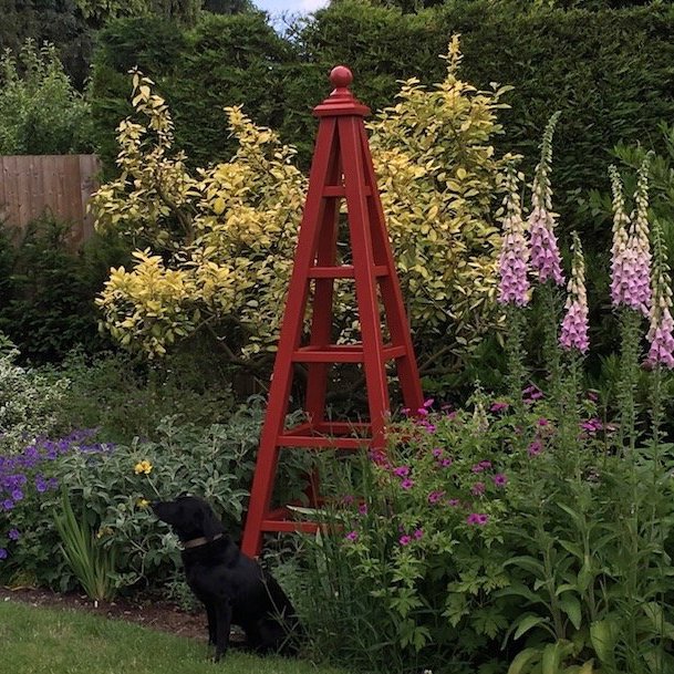 large garden obelisk painted bronze red