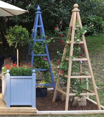 230cm tall Oak Garden Obelisk with red and white roses on display at RHS Chelsea Flower Show 2018
