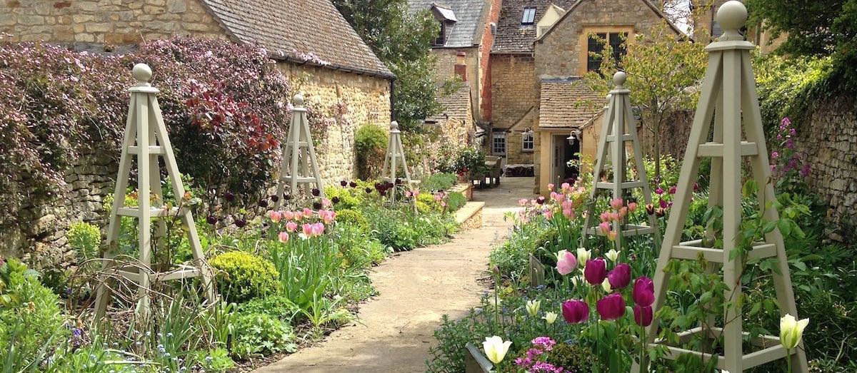 Painted Wooden Garden Obelisks in Cotswold Garden